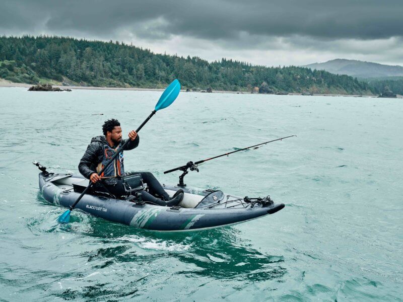 Inflatable kayak coursing through chilly waters